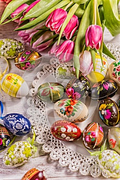 Multicolored spring tulips and Easter eggs with decorations