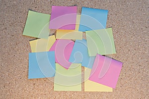 Multicolored sticky notes on a wooden table