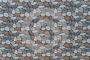 multicolored stone with rounded faces wall background.