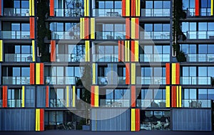 Multicolored stripes Detail on the facade of a modern apartment building