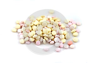 Multicolored tablets closeup with sofl natural shadows on white background