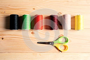 Multicolored threads and scissor