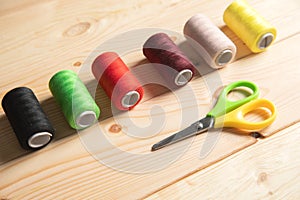 Multicolored threads and scissor