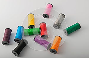 Multicolored threads, scissors and ruler.