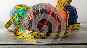 Multicolored threads, scissors and ruler.