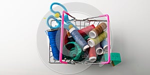 Multicolored threads, scissors and ruler.