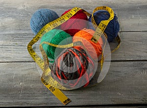 Multicolored threads, scissors and ruler.