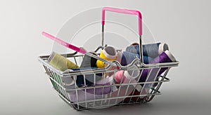 Multicolored threads, scissors and ruler.