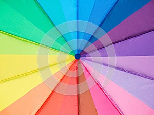 Multicolored umbrella close-up. Colors of the LGBT community. Background, texture