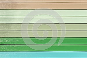 Multicolored vinyl siding with simulated wood texture. Plastic wall covering for exterior decoration of house. Abstract background