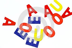 Multicolored vowels on white background