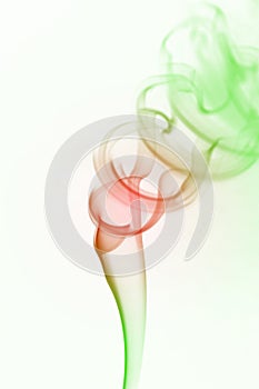 Multicolored wisp of smoke on white photo