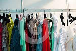Multicolored womens clothing hanging on the hanger horizontal