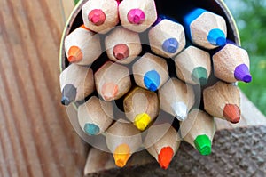 Multicolored wooden pencils in a box