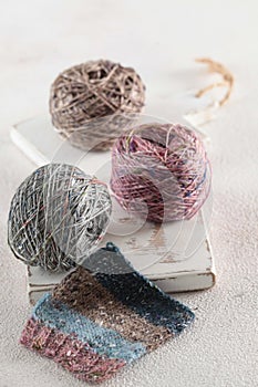 Multicolored yarn made of natural wool for knitting. Tweed yarn in tangles. Tweed. The concept of a hobby. Background