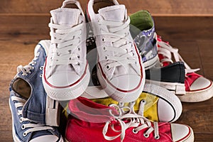 Multicolored youth gym shoes on floor