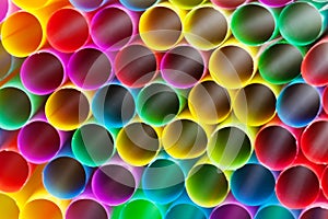 Multicoloured plastic drinking straws close up