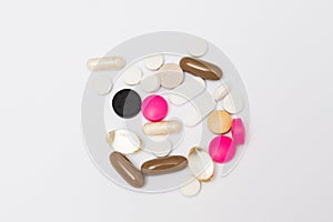 Multicoloured round pills, oval hard and soft capsules