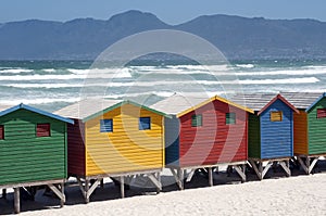 Multicoloured wooden bathing huts on the beach