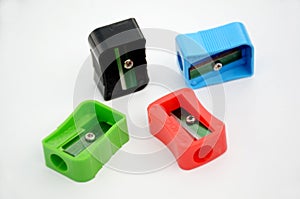 The multicolours four sharpner scattered floor isolated in white background photo