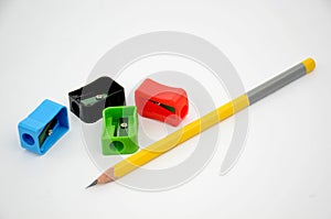 The multicolours four sharpner with yellow colour wooden pencil  isolated in white background