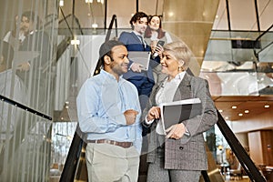 Multicultural business professionals in suits walk