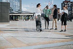 Multicultural business team discussing strategy outdoors