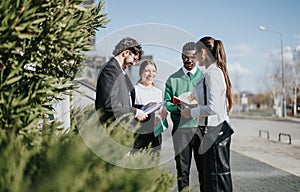 Multicultural business team strategizing outdoors, discussing growth and market expansion