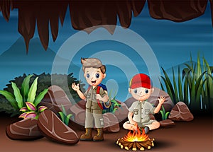 The multicultural children camping in cave