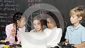 Multicultural children using laptop programing engineering code. Erudition. photo