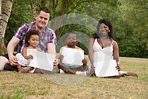 Multicultural family with blank boards