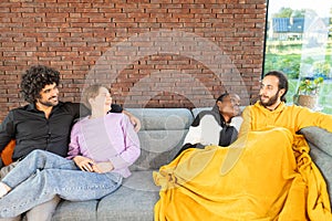 Multicultural Friends Enjoying Relaxed Time on Sofa