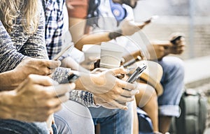 Multicultural friends group using smartphone with coffee cup photo