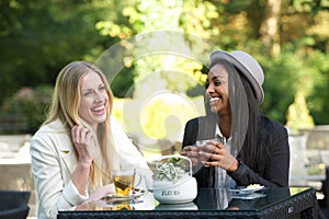 Multicultural Friends Laughing and Drinking Tea