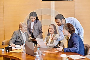 Multicultural group of business professionals discussing