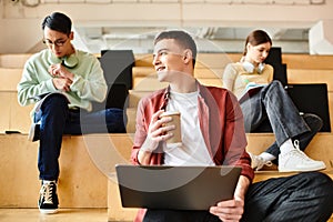 A multicultural group of students listening