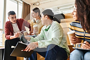 A multicultural group of students sitting