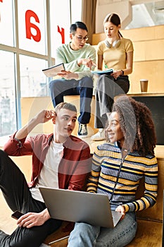 A multicultural group of students sitting