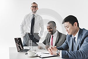 multicultural smiling businessmen having meeting