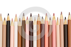 Multiculture skin tone color pencils background isolated on white