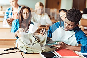 group of young multiethic students sitting