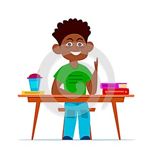 Multiethnic boy at school desk in classroom, smiling child sitting on chair with books, african student in class