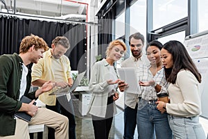 multiethnic business colleagues with laptop and