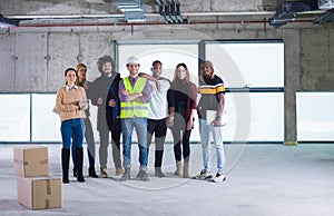 Multiethnic business people in group, architect and engineer on construction site