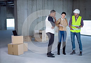 Multiethnic business people in group, architect and engineer on construction site