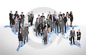 Multiethnic business people standing on world map