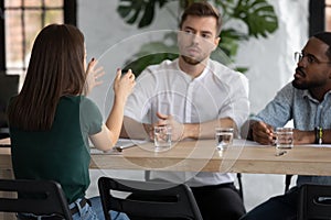 Multiethnic business team brainstorming at meeting table