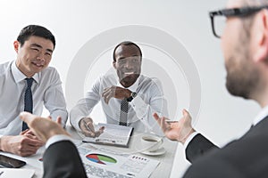 multiethnic businessmen having discussion during meeting