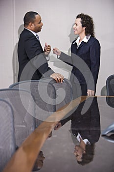 Multiethnic businesspeople conversing photo