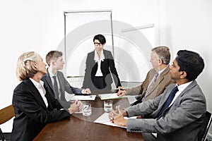 Multiethnic businesspeople at meeting in conference room